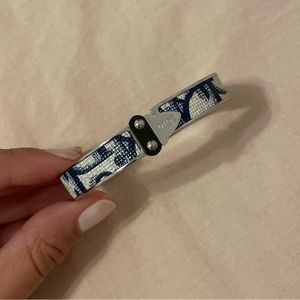 INSPIRED bangle. Close clasp.